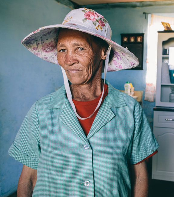 Elderly person wearing a hat